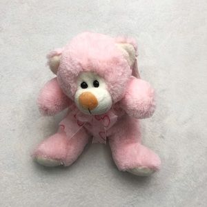 Pink stuffed animal bear with bow